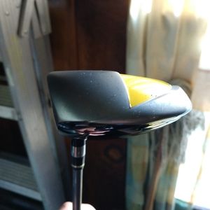 Assorted golf clubs with bag and accessories